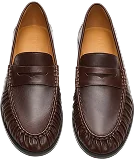 A pair of dark brown leather penny loafers